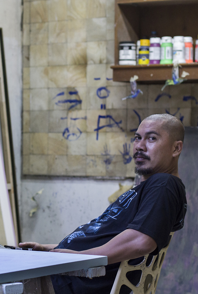 <p style="text-align: justify;"><strong>Jumaldi Alfi</strong> (b. Lintau, Sumatra, Indonesia) has consistently been exploring new possibilities in painting. Over the past ten years his paintings have shown shifting themes and styles. He is particularly known for his compelling personal iconography of visual signs, reflecting existential and spiritual experience on both, an individual and collective level. In creating his comprehensive painting series such as <em>Blackboard Paintings</em> or, more recently, the series of <em>Melting Memories, Collage Paintings</em>, Alfi draws on a scope of references from text to empirical objects of the natural world to Renaissance paintings and his own memories; the effect of his work being at once mysterious and intimate. Jumaldi Alfi lives and works in Yogyakarta, Indonesia and has exhibited extensively in Asia as well as internationally. Recent important exhibitions include <em>Re-reading Landscape, Mooi Indies</em>, ARNDT Singapore, 2014 and <em>Do not Shoot the Painter</em>, UBS Collection exhibition, Galleria d'Arte Moderna, Milan, Italy, 2015. Alfi is a member of the artists&rsquo; group Jendela and a co-founder of the artists&rsquo; initiative and cultural platform OFCA International (Office For Contemporary Art). As co-founder of several artists collectives he developed SaRanG, a location which provides a physical infrastructure of several buildings hosting different art institutions in Yogyakarta, Indonesia.</p>
<p style="text-align: justify;">photographed by Benny Kurniadi</p>